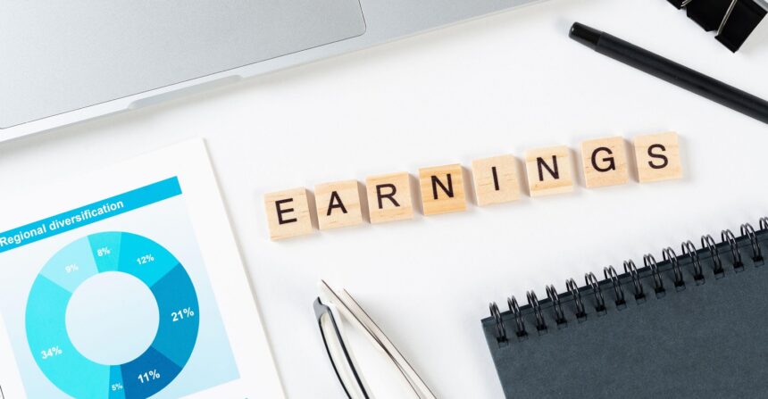 earnings written on a pad of paper