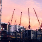 Evening cranes over a data center construction site