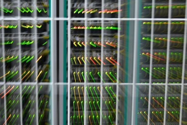 A picture taken in 2020 shows a zooming effect of LEDs on network infrastructure at the datacenter of French mobile communications company SFR in Cesson-sevigne, in the suburbs of Rennes, western France.