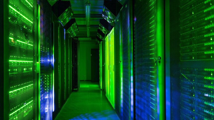 Data center server room lit with green lights