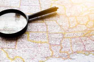 Magnifying glass on a map of the United States