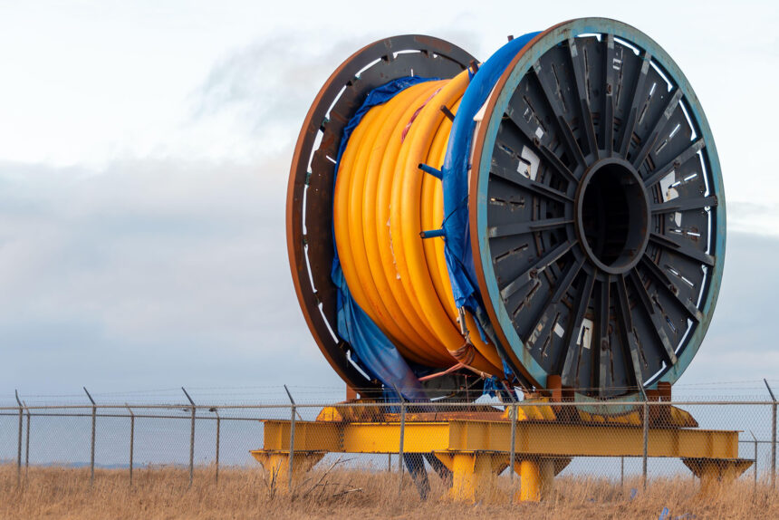 Underwater cable on a metal spool on a ship