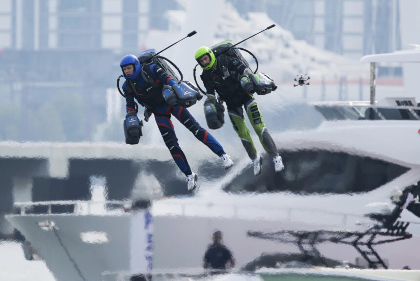 'Iron Man' pilots race in jet suits against a backdrop of Dubai skyscrapers