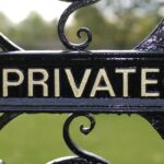 shutterstock 64776670 Private sign on vintage black iron gate with foresty estate in the background