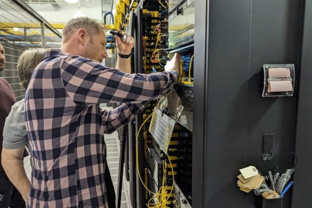 Summit CEO Warren Patterson is taking a hands-on approach - At a Deft data center, shown alongside Deft engineers.
