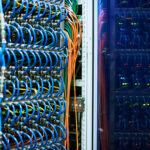 supercomputer in a server room with many wires coming from it