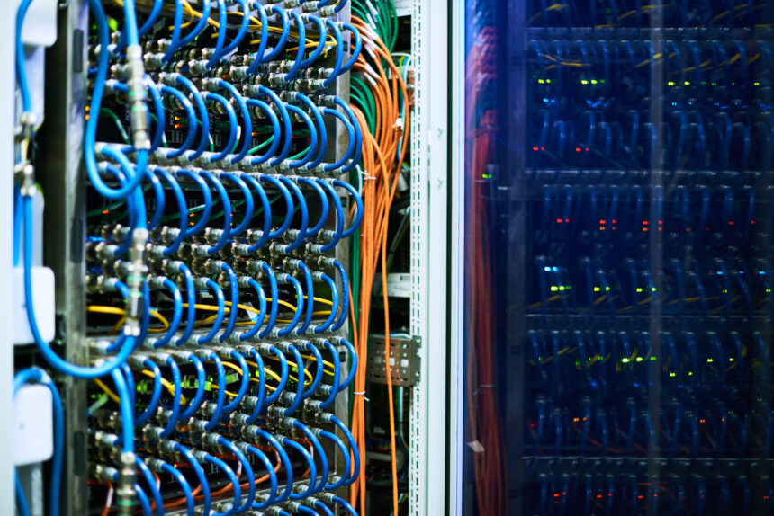 supercomputer in a server room with many wires coming from it