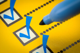 yellow checklist with blue marker