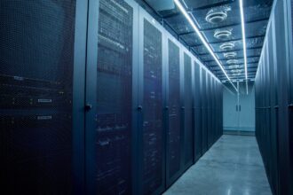 a row of server racks in a blue-tinted data center