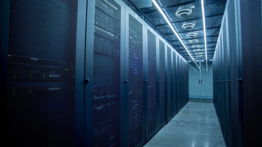 a row of server racks in a blue-tinted data center