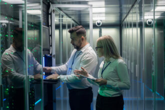 People working inside a data center.