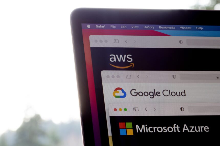 AWS, Google Cloud, and Microsoft Azure logos are seen respectively on the websites of the big three cloud providers on a laptop computer.