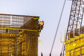 Two workers on the construction of a building for Samsung in San Jose California USA