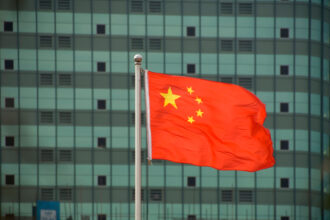 Chinese flag in front of building