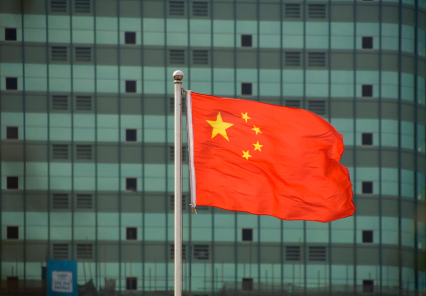 Chinese flag in front of building