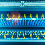 Fiber optic cables connected to an optic ports in a data center