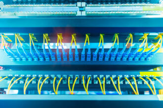 Fiber optic cables connected to an optic ports in a data center