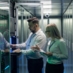 People working inside of a data center