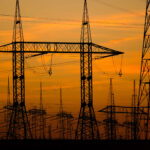High voltage towers at sunset