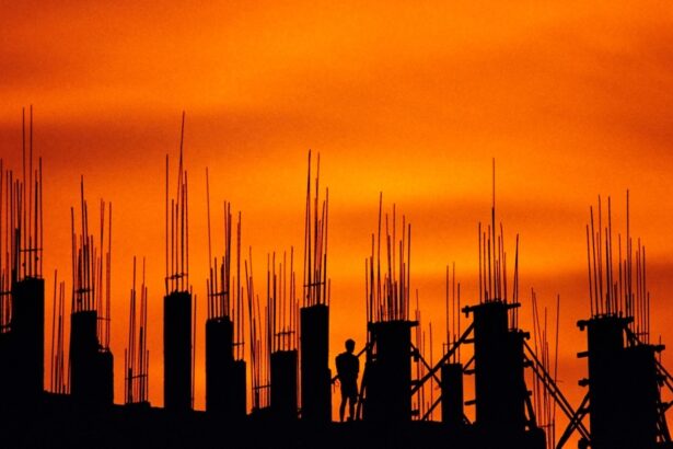construction site silhouette against orange sky