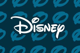 The Disney logo over a blue and black background with tiled circles in the style of Disney’s logo.