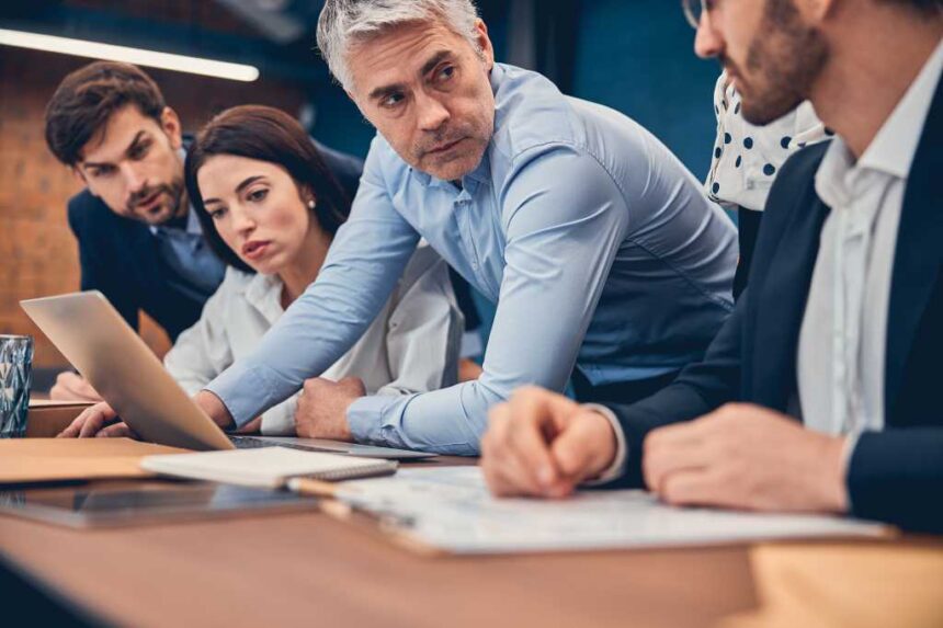 Smart confident people having a business meeting while working in the office