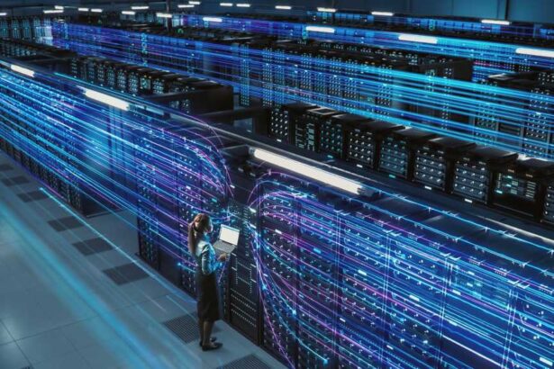 big data center female tech using laptop in data warehouse