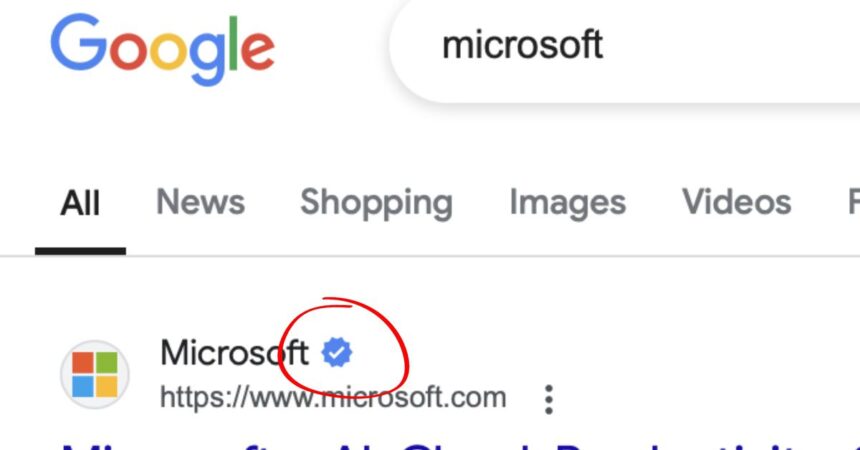 A screenshot taken of Google search displaying a blue checkmark next to a Microsoft weblink.