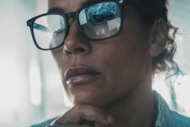 data reflecting on woman’s glasses