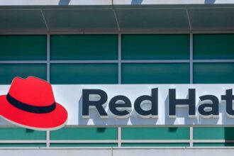 Red Hat logo and sign on open-source software company office in Silicon Valley. Red Hat has its corporate headquarters in Raleigh, North Carolina - Sunnyvale, California, USA