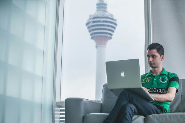 Man working on a computer illustrating a report from the Tony Blair Institute highlighting AI's potential impact on the workforce, including the opportunities and risks to the labor market and how government and policymakers can mitigate the challenges.