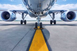 shutterstock 637037008 underside of jet aircraft and jet turbines on runway