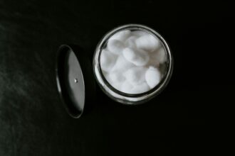 Container with cotton balls illustrating an AI partnership between L’Oréal and IBM to use foundation models to improve sustainability and innovation in the beauty and cosmetics industry.