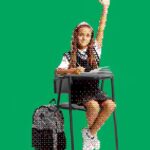 Photo collage of a pixelated student at a desk.