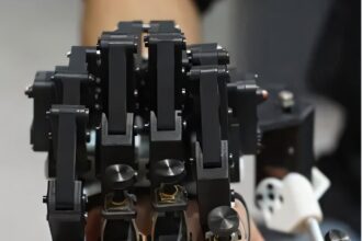 Use of robotic hand exoskeleton helps pianists improve their playing speed