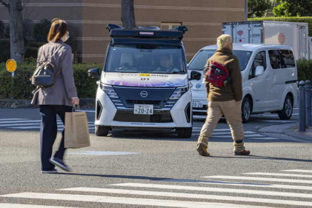 Japan's Nissan tests driverless vehicles in city streets filled with cars and people