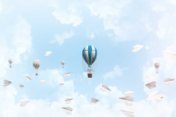 shutterstock 1117048970 colorful balloons flying among paper planes and against a cloudy blue sky