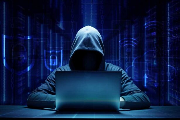 hooded hacker online security concept