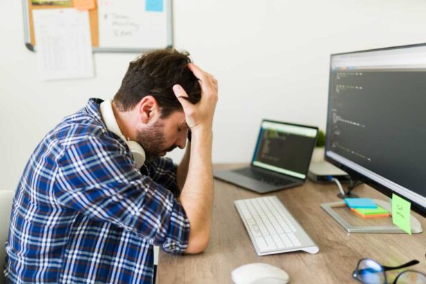 Stressed upset programmer having problems developing new software and looking worried because of the coding of an app