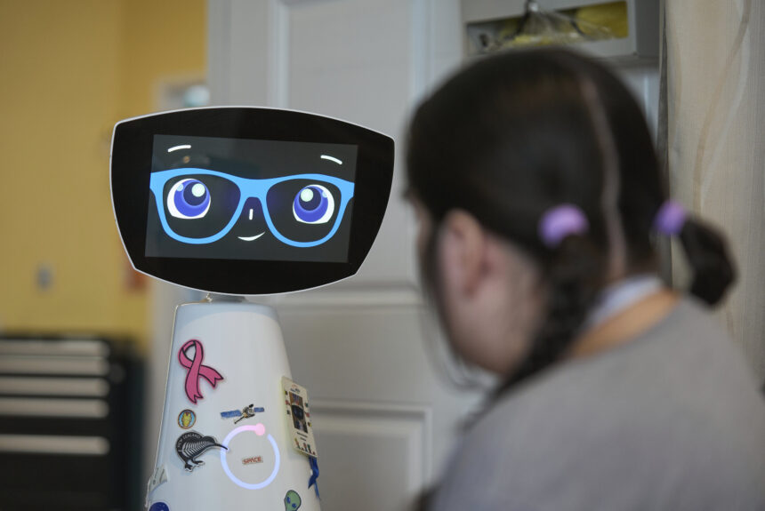 A robot programmed to act like a 7-year-old girl works to combat fear and loneliness in hospitals