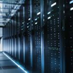 Photo of Out of Focus IT Technician Turning on Data Server.