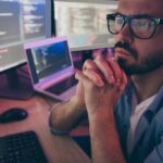 Close-up cropped view portrait of his he nice attractive skilled professional smart focused guy monitoring client