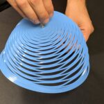 Kirigami parachute suitable for humanitarian missions stabilizes quickly and doesn't pitch