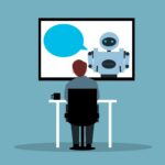 Employee chatting to a chatbot as new adoption data from Perplexity reveals how AI agents are driving workflow efficiency gains by taking over complex enterprise tasks.