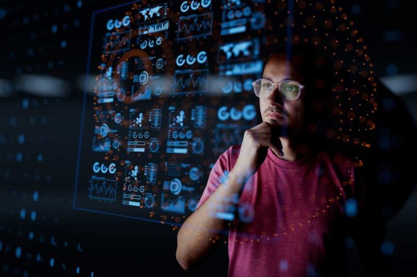 Man look at the dashboard with graphs and charts. Concept of data management system, business intelligence, data statistics, marketing analysis, key performance indicators (KPI) and analytics.