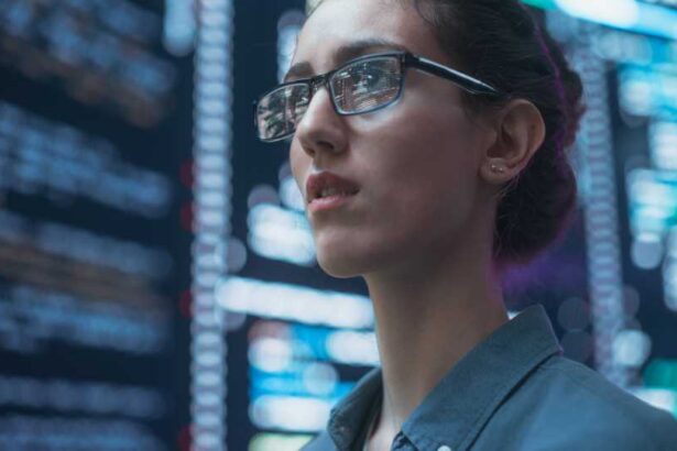 Close Up Portrait of Woman Working on Computer, Lines of Code Language Reflecting on her Glasses from Big Display Screens. Female Programmer Developing New Software, Coding, Managing Cybersecurity