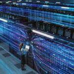 image of Woman holding laptop in data center