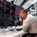 Unhappy Programmer Caught In Maze Of Broken Software And Stress.