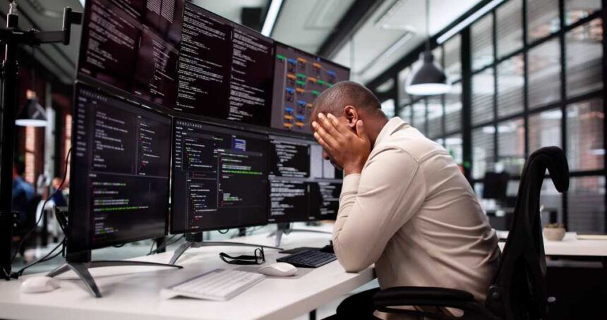 Unhappy Programmer Caught In Maze Of Broken Software And Stress.