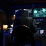 Cybercriminal fraudulently breaching security systems while hiding in secret HQ. Hacker breaking down security systems defenses using rogue scripts to steal valuable data, camera B